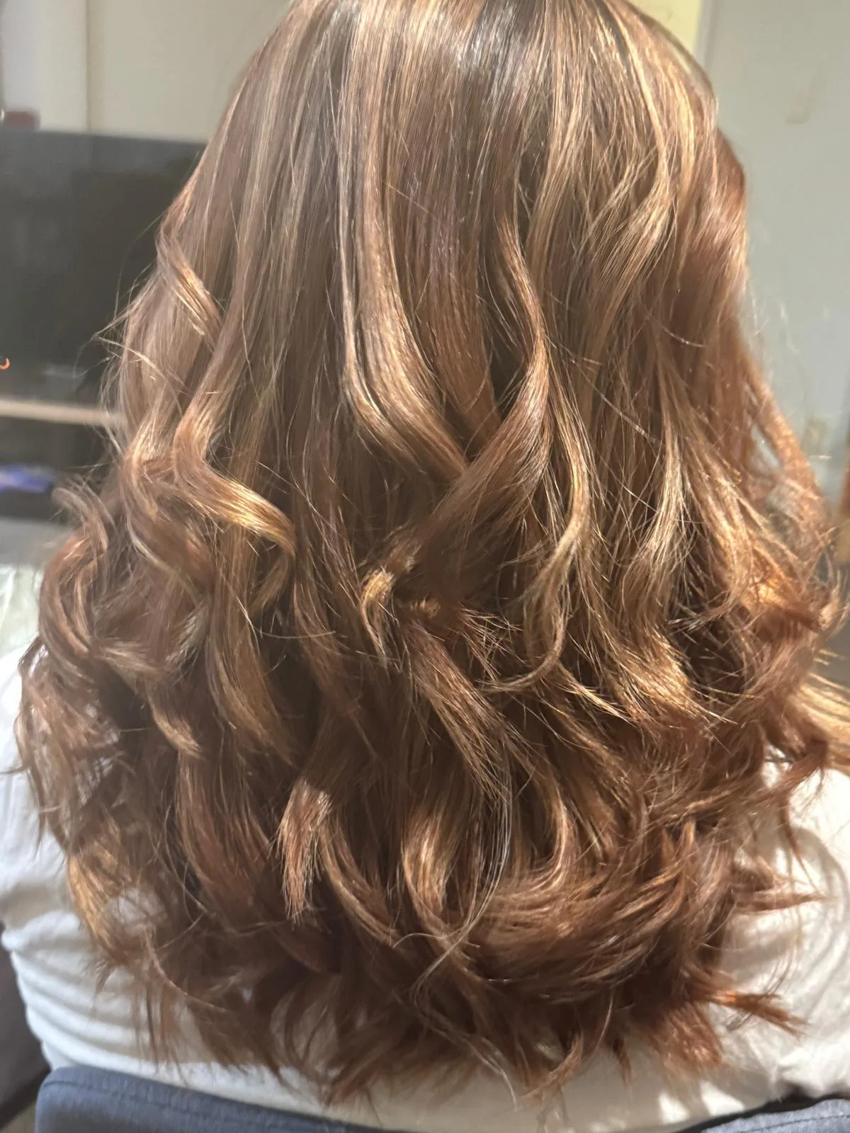 Soft copper curls coloured by Carolyn, Redcliffs colourist